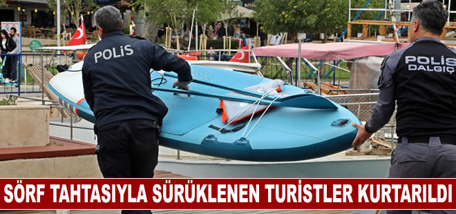 Antalya'da sörf tahtasıyla açığa sürüklenen turistleri deniz polisi kurtardı